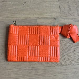 Orange zip cosmetic bag, NWOT